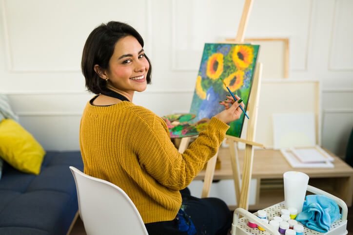 A student practising her painting skills for her future career