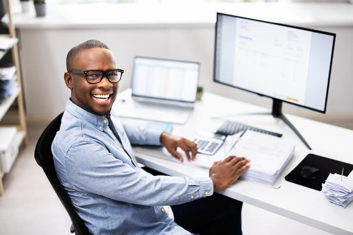 A payroll administrator working on a payroll management system