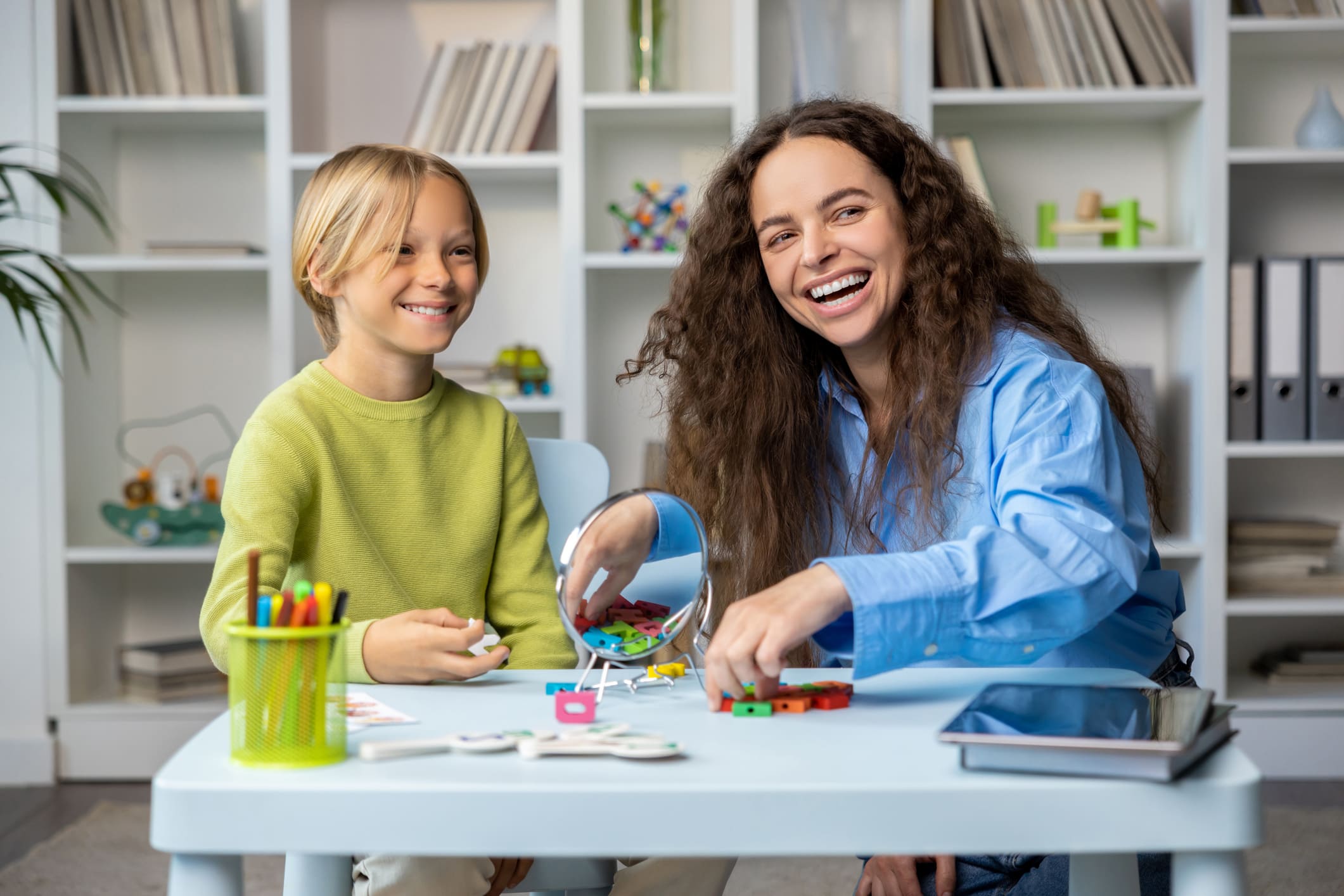 Educational assistant helping a student with learning activities and focus.